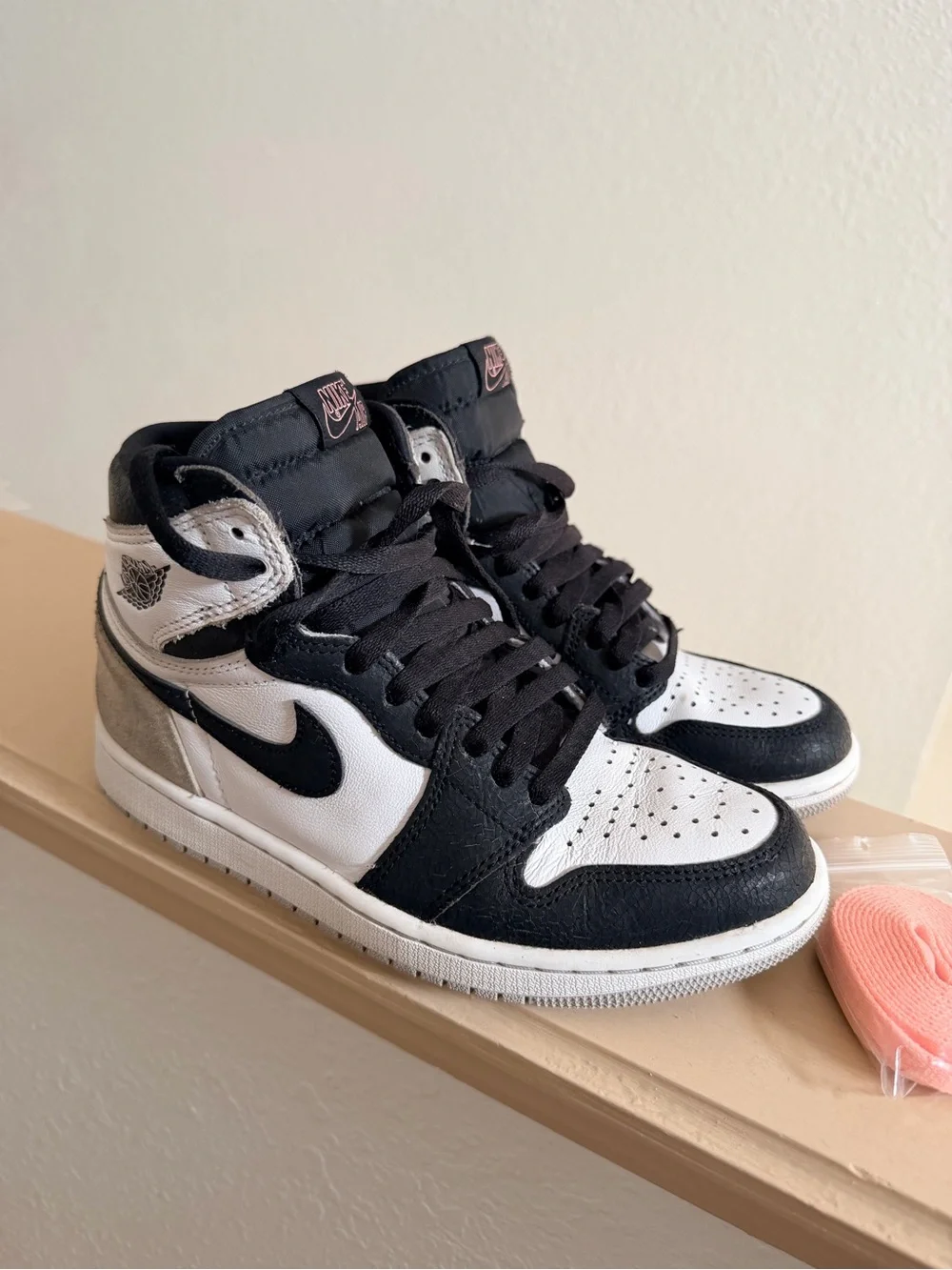 Nike Air Jordan 1 Black and White High-Top Sneakers with Pink Accent